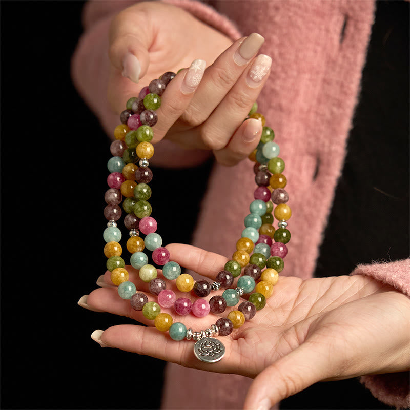 108 Mala Tourmaline Lotus Wisdom Bracelet - cradled in both hands, lotus charm on palm, Healing