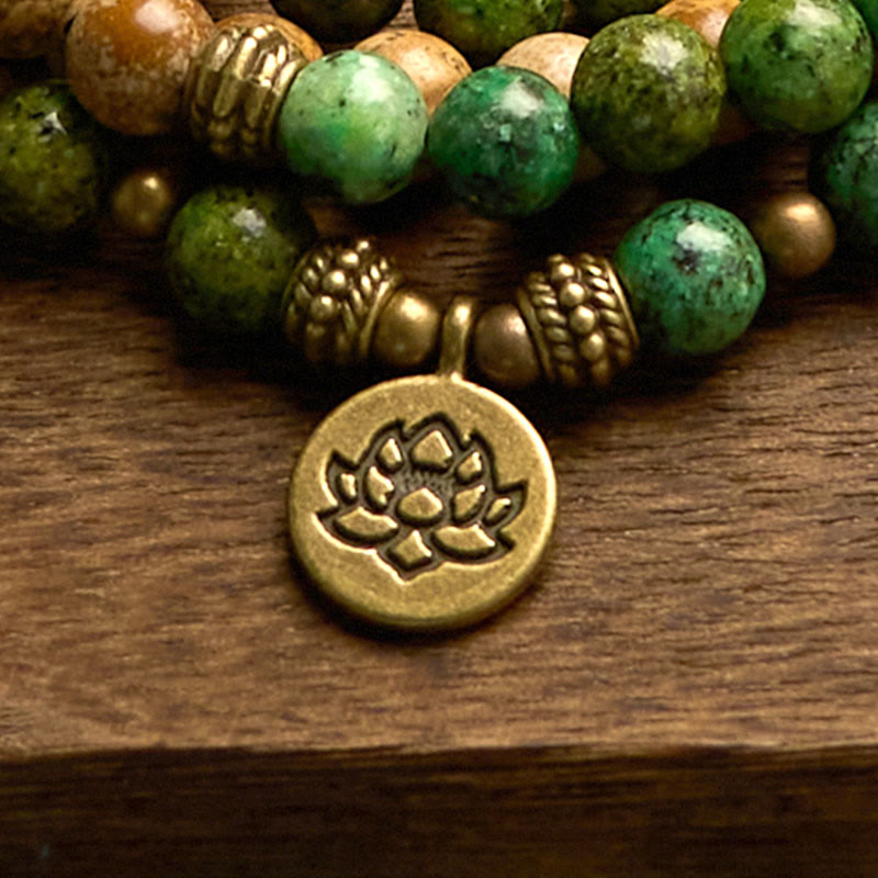 108 Mala Picture Jasper Turquoise Lotus Bracelet - brass lotus charm close-up, stone bead detail, Stability