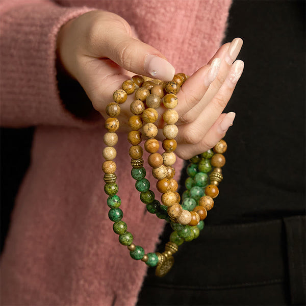108 Mala Picture Jasper Turquoise Lotus Bracelet - cradled in both hands, brass lotus charm, Stability