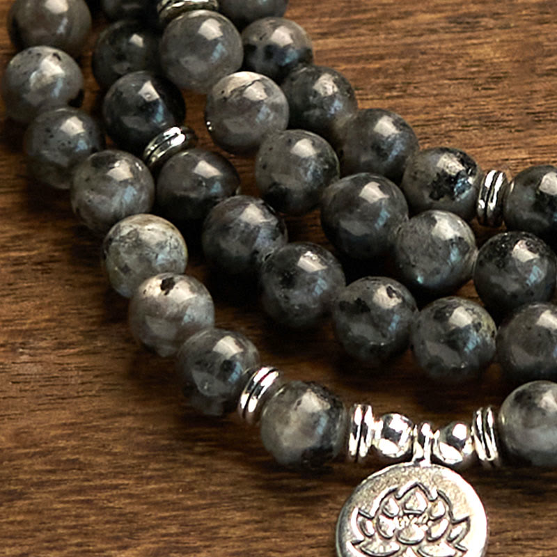 108 Mala Black Glitter Stone Lotus Bracelet - faceted black stone macro on wood, lotus medallion, confident energy