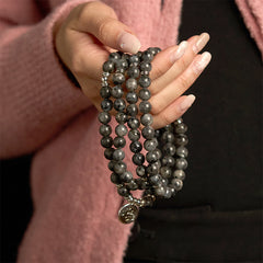 108 Mala Black Glitter Stone Lotus Bracelet - dark stone strands on wrist, lotus charm, pink knit, empowering