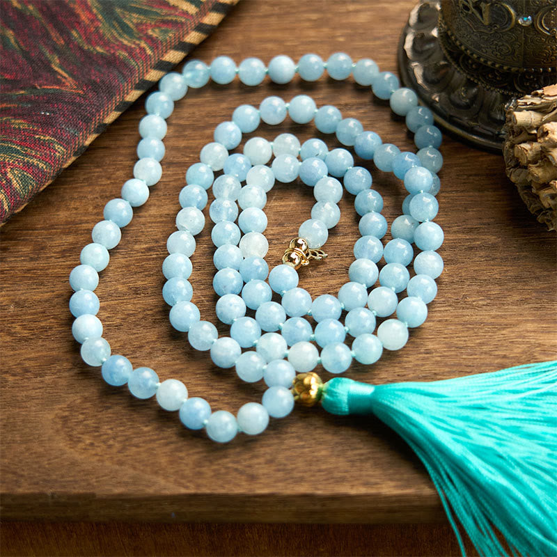 108 Mala Aquamarine Lotus Healing Bracelet – three concentric loops of pale blue beads with turquoise tassel, Serenity