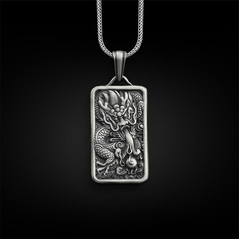 Pure Tin Dragon Pendant Necklace – antique silver dragon relief on black bg, Powerful