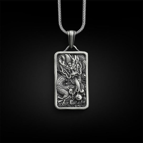 Pure Tin Dragon Pendant Necklace – antique silver dragon relief on black bg, Powerful