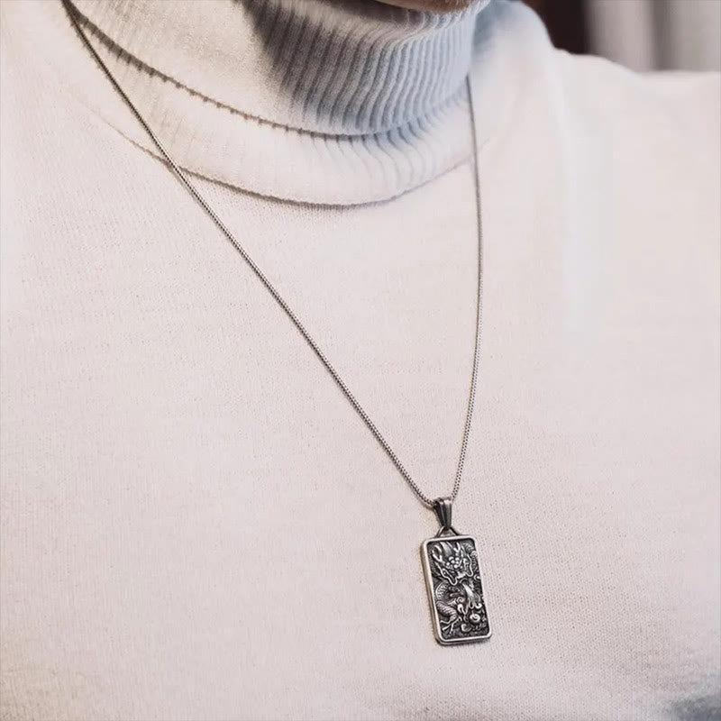 Pure Tin Dragon Pendant Necklace – worn on cream turtleneck lifestyle shot, Wearable