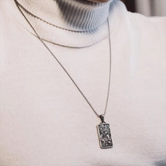 Pure Tin Dragon Pendant Necklace – worn on cream turtleneck lifestyle shot, Wearable