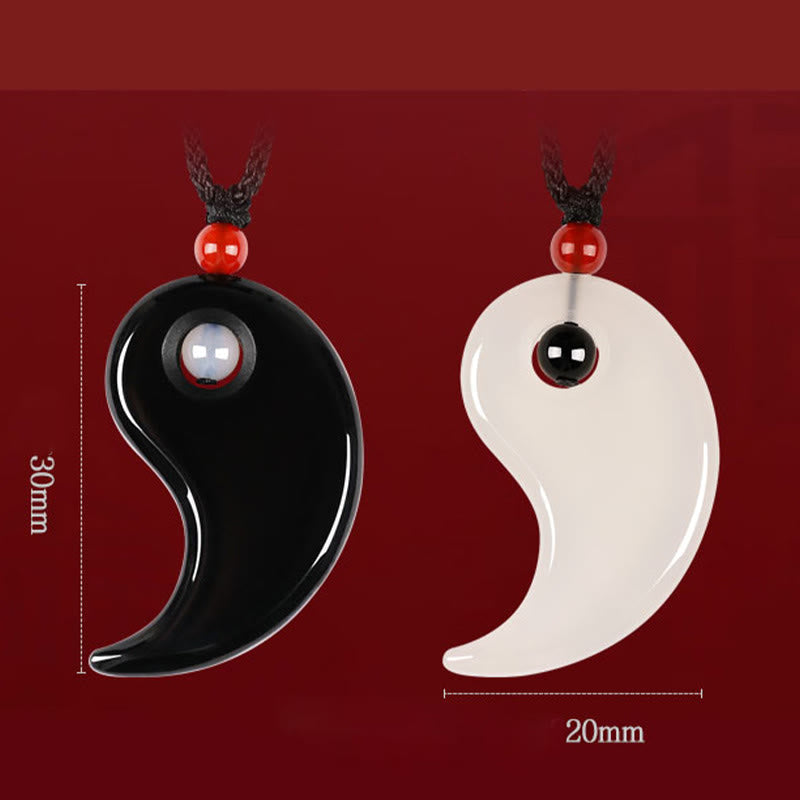 Black Onyx White Agate Yin Yang Necklace - Front view of split yin-yang couple pendants with dimension markers showing 30m...