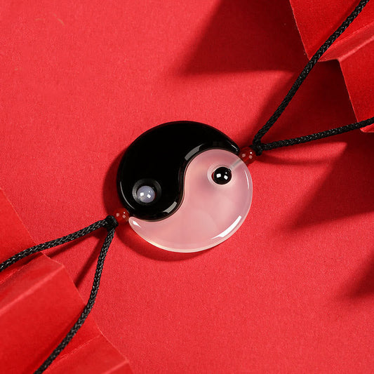 Black Onyx White Agate Yin Yang Necklace - Complete yin-yang pendant showing glossy black obsidian and translucent white a...