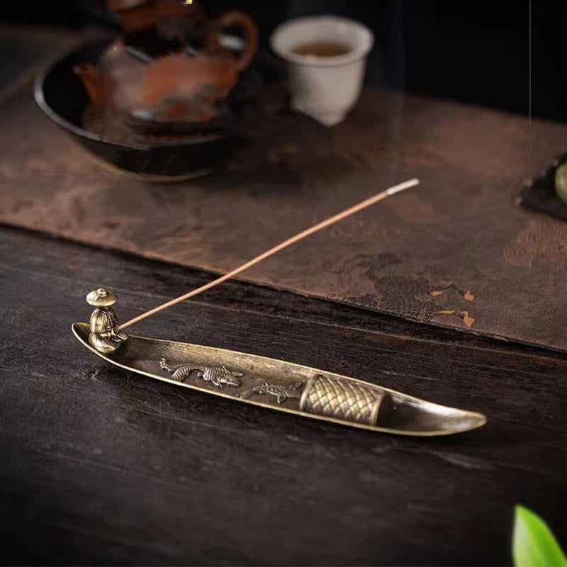 Koi Fish Boat Incense Burner - bronze boat with fisherman and burning incense, tea ceremony setting