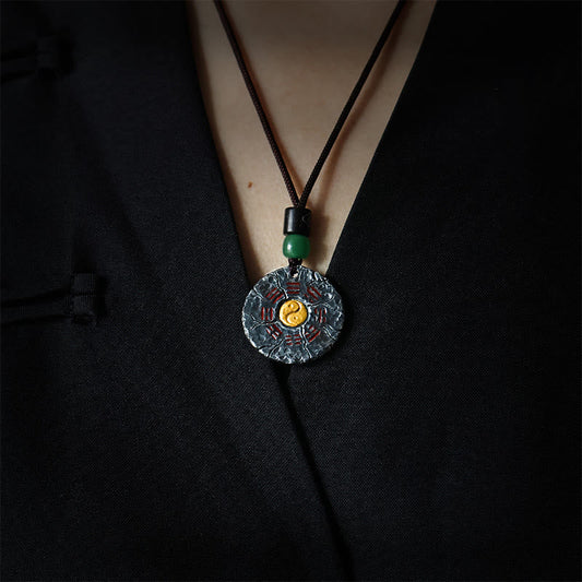 Sterling Silver 24K Gold Bagua Yin Yang Mountain Ghosts Pendant - Worn on model in black mandarin collar garment, dramatic...