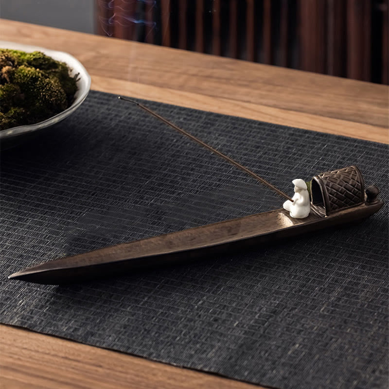 Fisherman Zen Ceramic Incense Burner – Elevated view of boat holder with monk statue under canopy and burning incense