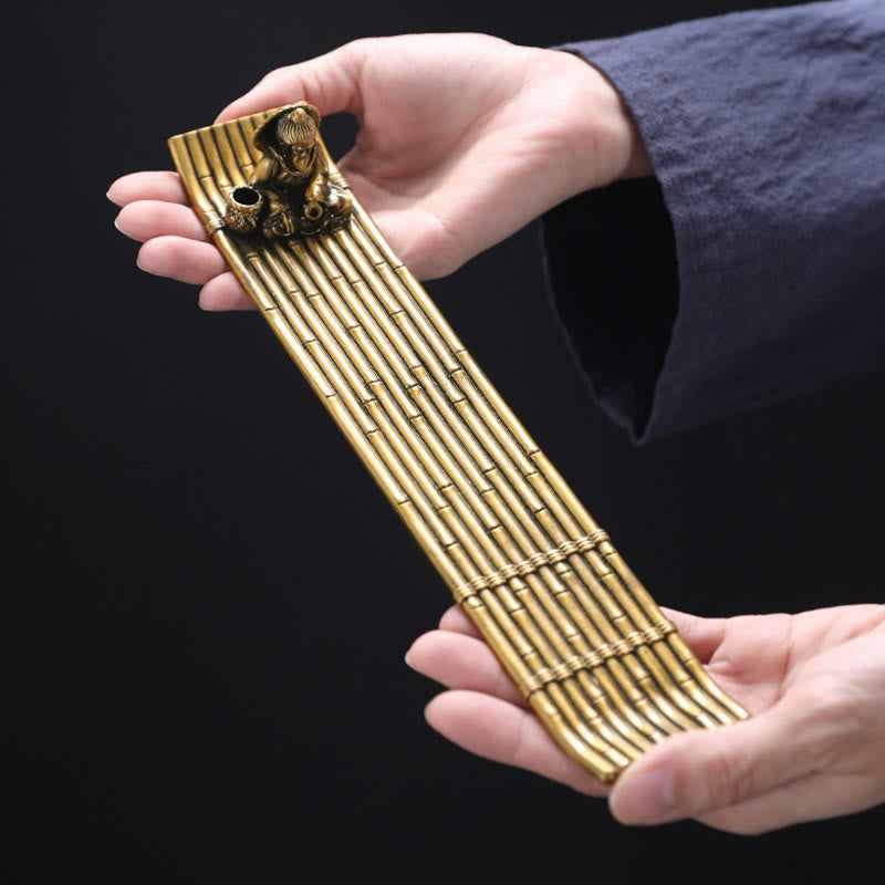 Bamboo Fishing Boat Alloy Incense Burner – hands holding brass raft burner showing scale, artisan crafted detail