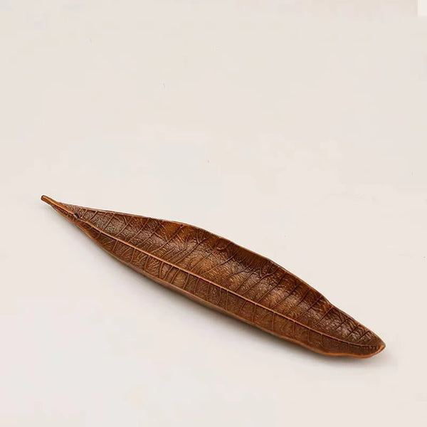 Oriental Leaf Alloy Incense Burner – brown leaf holder angled view on white, natural texture and curved shape