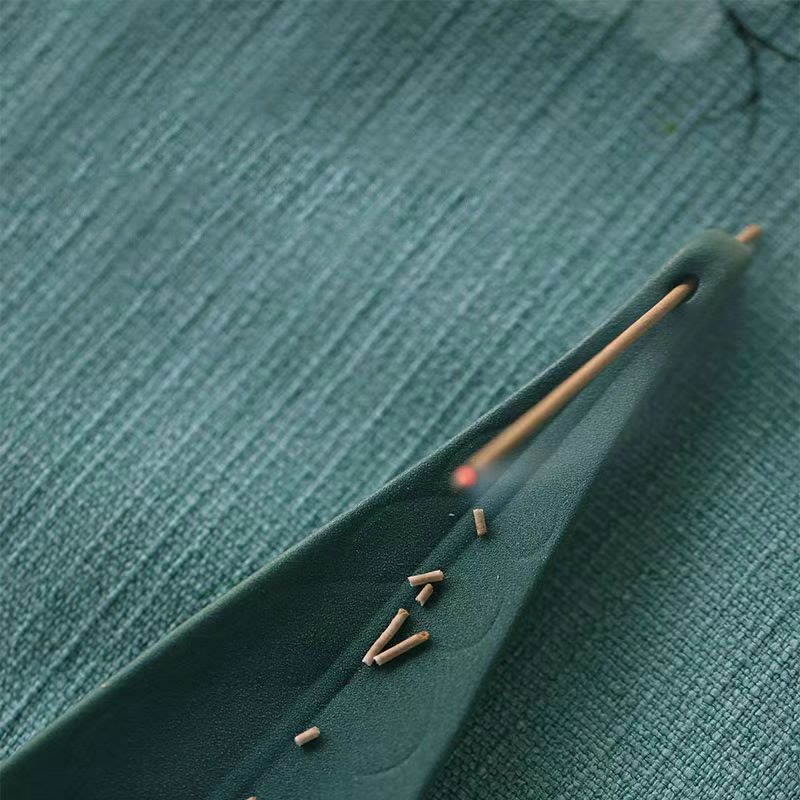 Willow Leaf Ceramic Incense Burner – Ash collection groove with burning incense, functional design detail