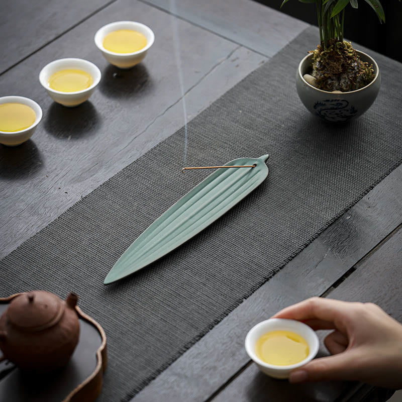Green Bamboo Leaf Ceramic Incense Burner – light green leaf incense holder in full tea ceremony scene with teapot and cups