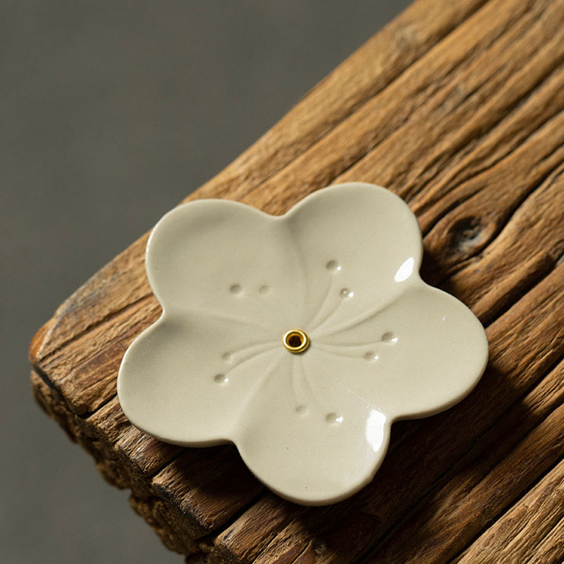 Floral Lotus Ceramic Incense Burner - five-petal flower with charred incense, warm wood grain, zen