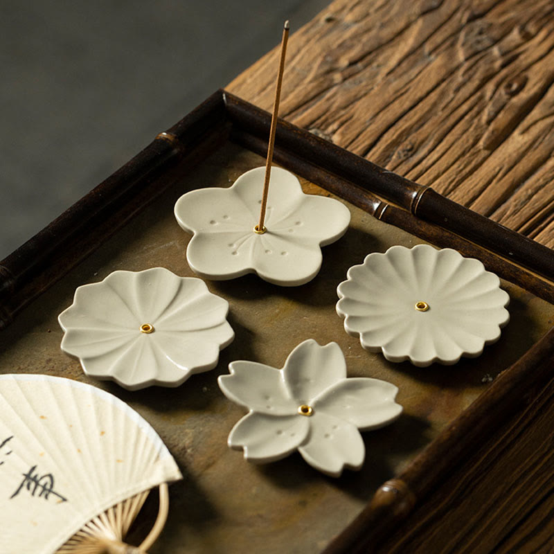 Floral Lotus Ceramic Incense Burner - four floral designs flat-lay on weathered wood, collection