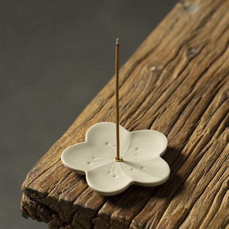 Floral Lotus Ceramic Incense Burner - low angle blossom with smoke wisp, dark moody calm, peaceful