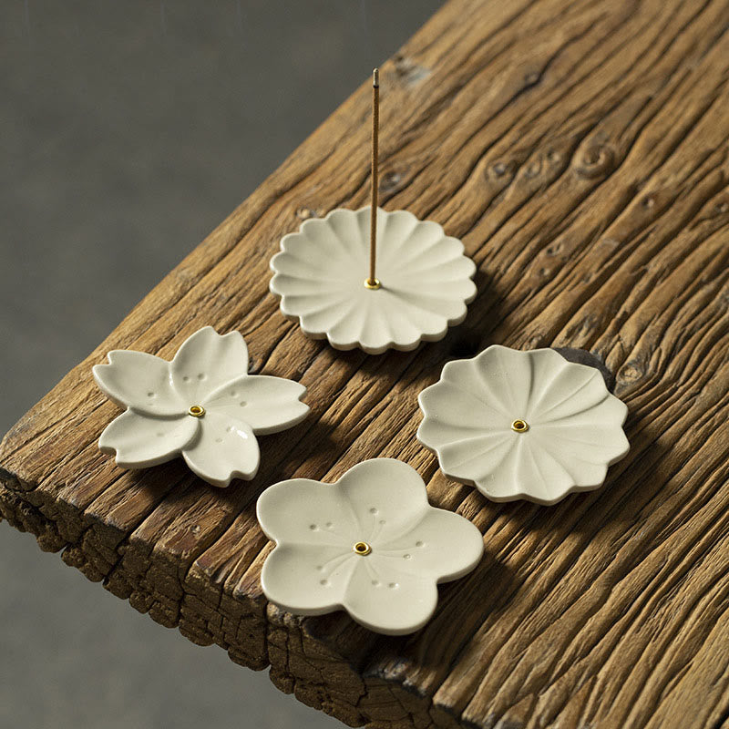 Floral Lotus Ceramic Incense Burner - chrysanthemum and plum blossom set on wood, one with incense
