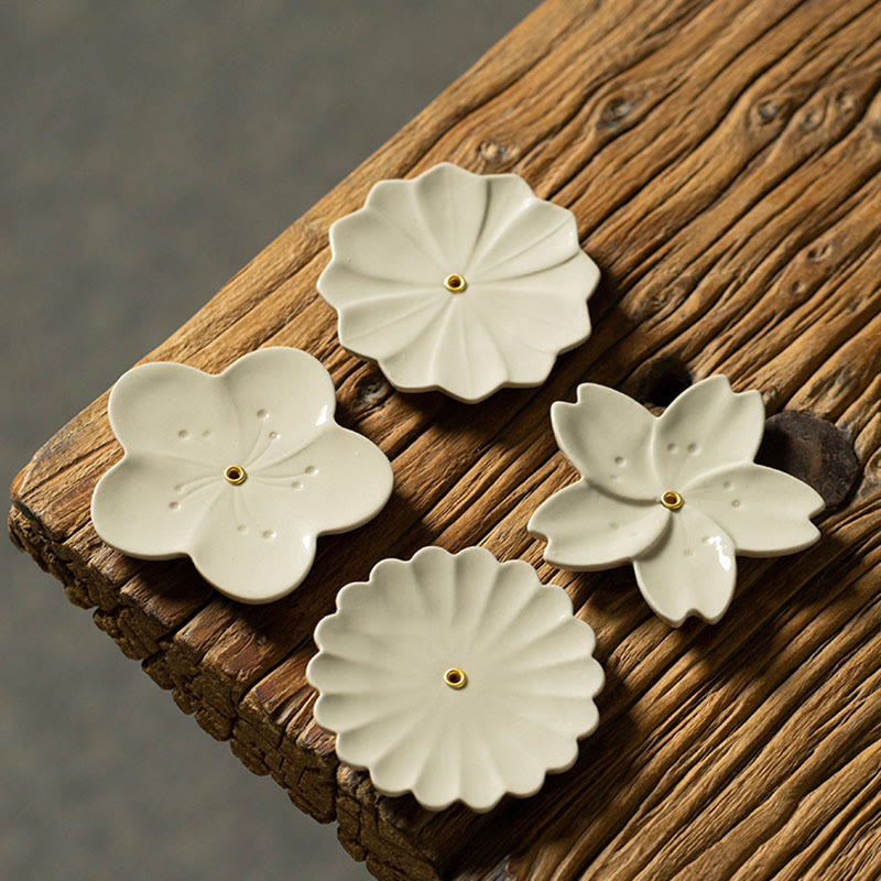 Floral Lotus Ceramic Incense Burner - five-petal and chrysanthemum pair, one lit, wood surface, harmony