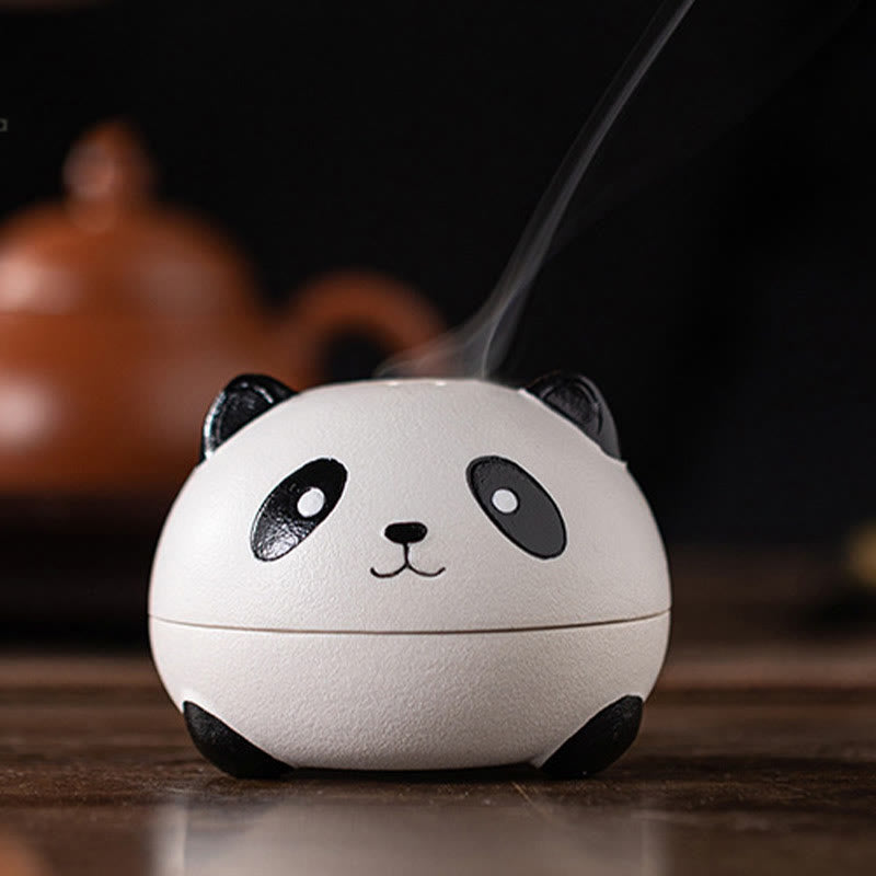 Cute Panda Ceramic Incense Burner – Close-up front face on reflective table, teapot silhouette behind