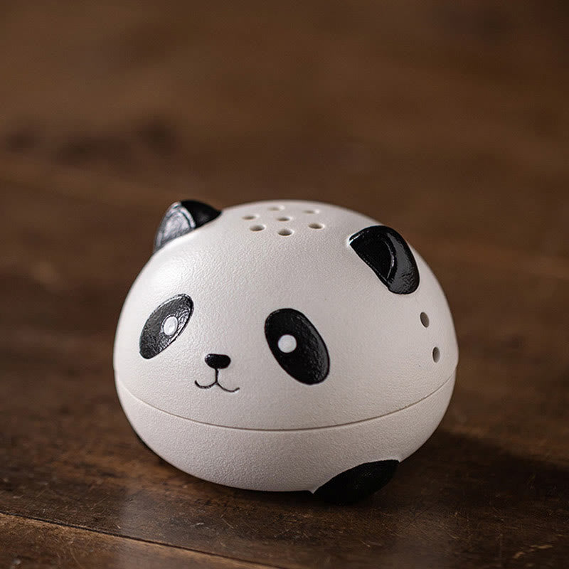 Cute Panda Ceramic Incense Burner – Panda head resting on dark wood table, matte white ceramic side view