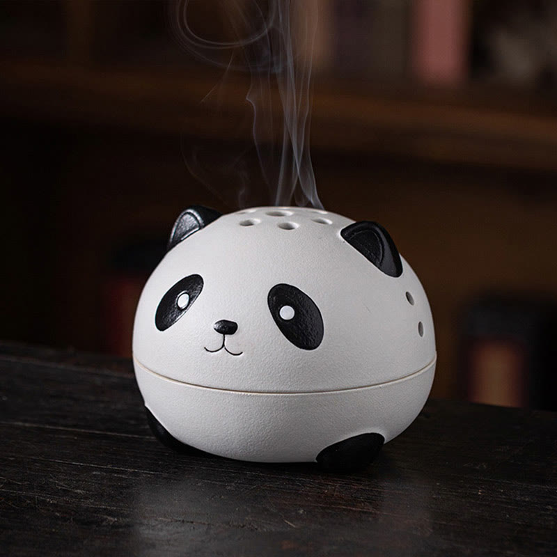 Cute Panda Ceramic Incense Burner – Front view on dark wood with smoke rising, warm bookshelf background