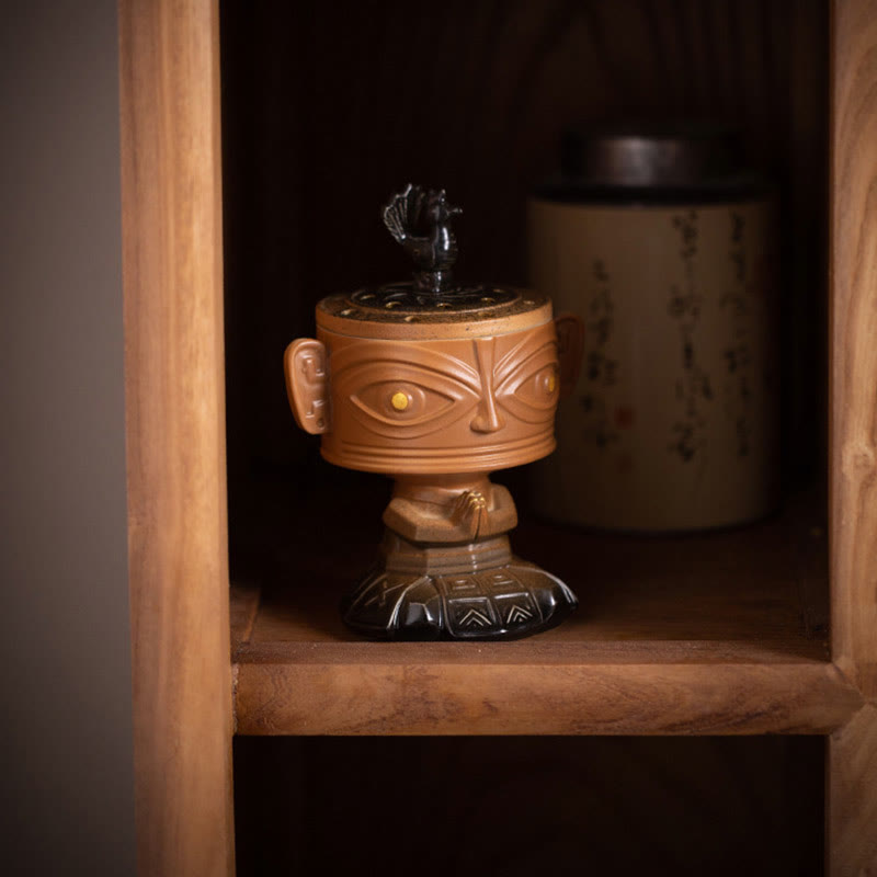Sanxingdui Ceramic Incense Burner – yellow mask burner displayed inside wooden cabinet shelf, oriental home accent