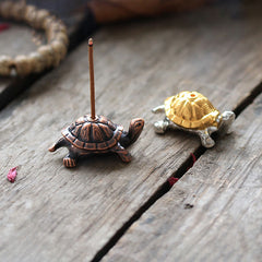 Alloy Turtle Snail Incense Burner – dual finish copper and gold turtle burners on rustic wood, zen aromatherapy decor