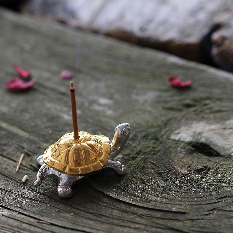 Alloy Turtle Snail Incense Burner – gold silver turtle with incense on aged wood, elegant zen statement