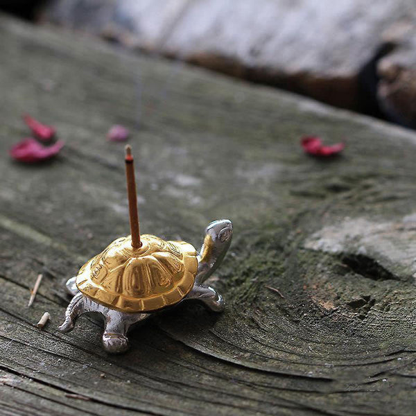 Alloy Turtle Snail Incense Burner – gold silver turtle with incense on aged wood, elegant zen statement