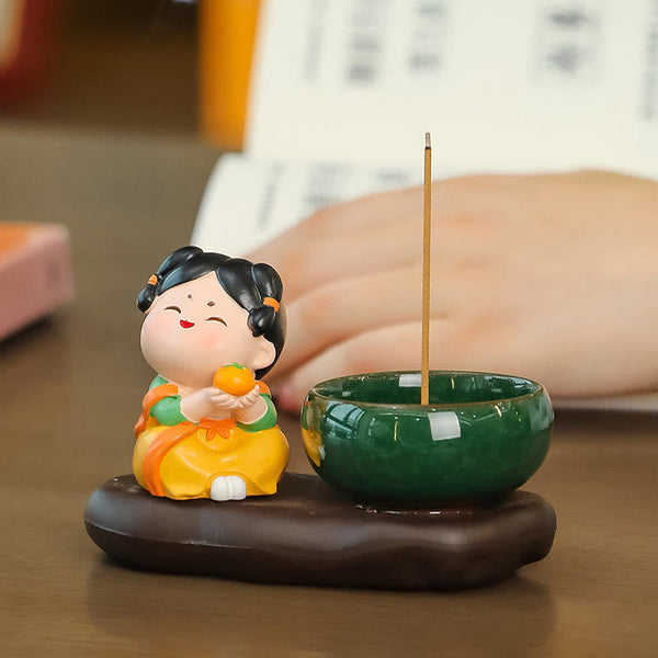 Tang Dynasty Lady Ceramic Incense Burner – Orange variant on wooden desk with book backdrop, cozy home accent