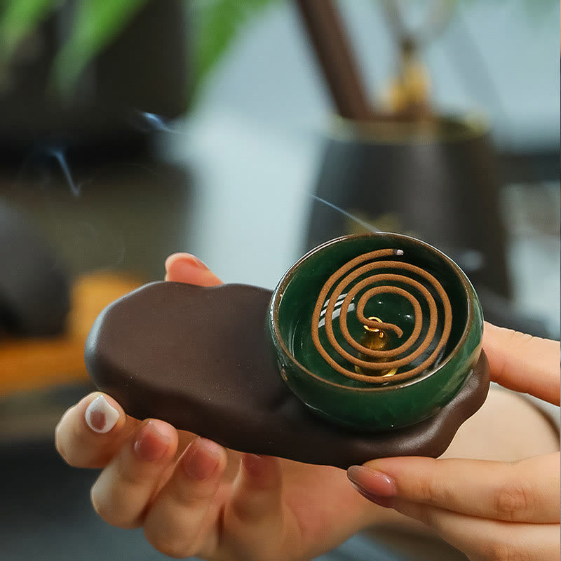 Tang Dynasty Lady Ceramic Incense Burner – Hand holding coil incense burning in green ceramic bowl