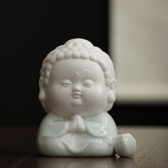 Ceramic Buddha Incense Burner – on wooden desk with books and tea, mindful workspace