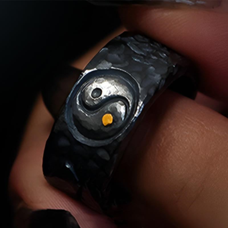999 Sterling Silver Yin Yang Ring - hand-held showing oxidized silver yin-yang with gold dot, spiritual balance jewelry