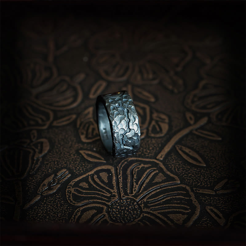 999 Sterling Silver Yin Yang Ring - side view standing showing volcanic hammered texture on dark gunmetal band, artisan ring