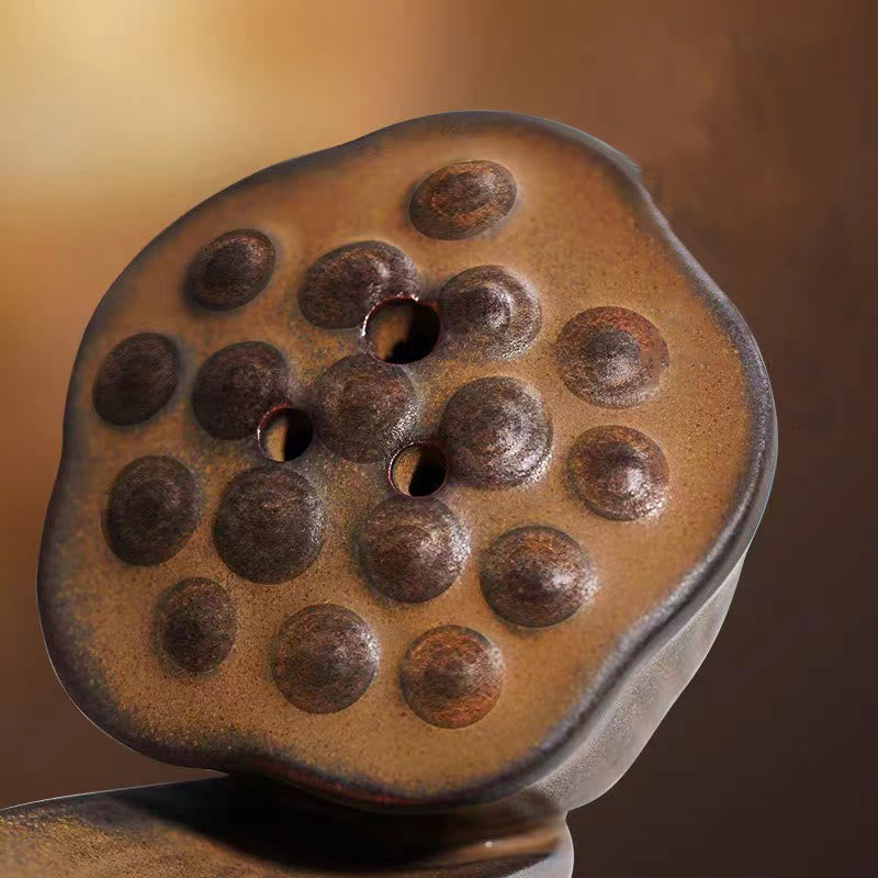 Brown Ceramic Lotus Pod Zen Incense Burner - seed pod top view with three holes, mottled earthy glaze