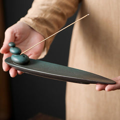 Ceramic Nature Incense Burner – Hand holding stacked stones design, artisan ceramic craftsmanship