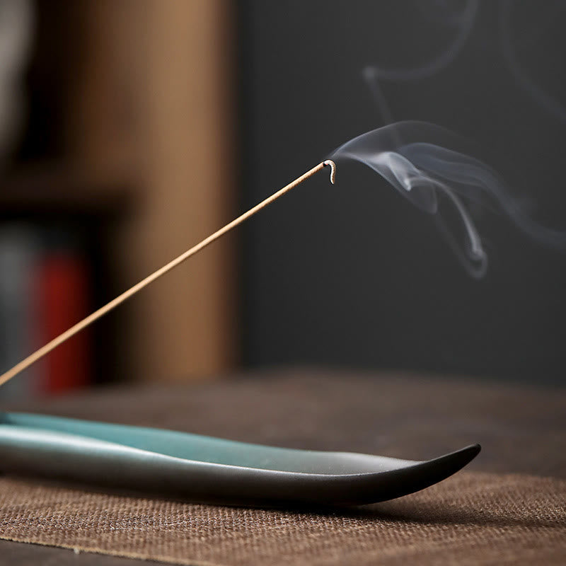 Ceramic Nature Incense Burner – Bamboo holder shallow depth smoke trail, atmospheric zen mood
