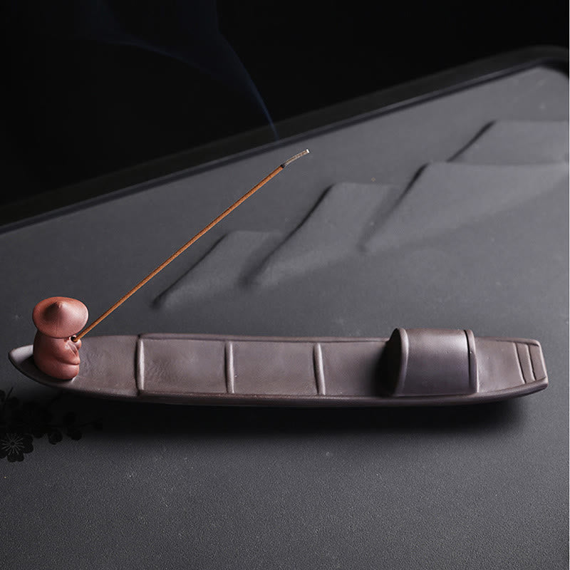 Fisherman Boat Purple Clay Incense Burner – front side view on tea tray with lit incense, soothing atmosphere