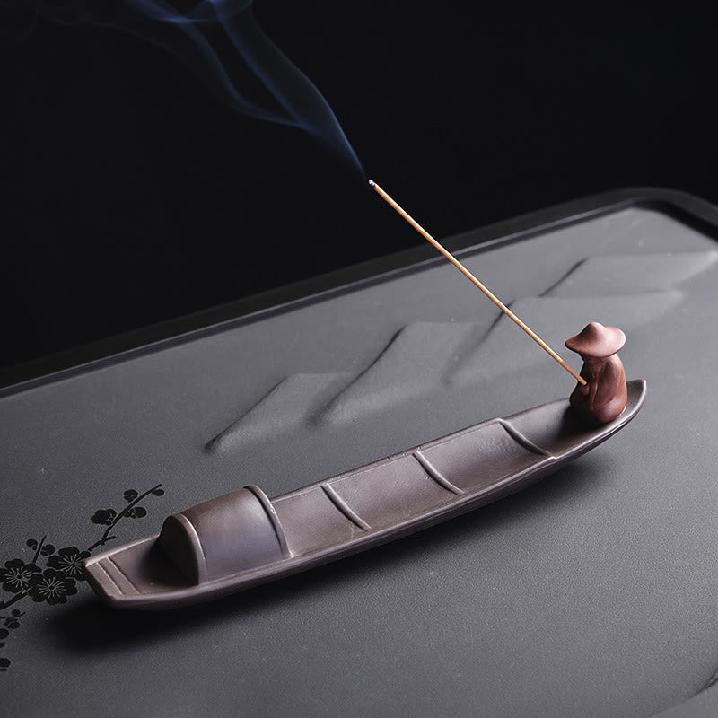 Fisherman Boat Purple Clay Incense Burner – mirrored side view on floral tea tray, tranquil home decor