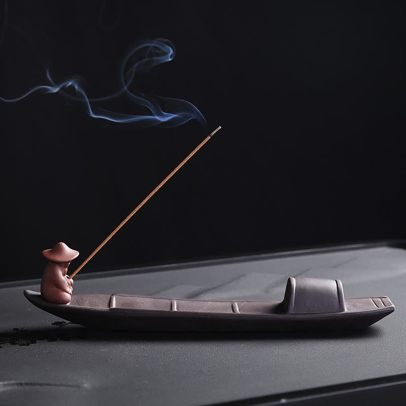 Fisherman Boat Purple Clay Incense Burner – side view with smoke drifting over dark tea tray, serene zen decor