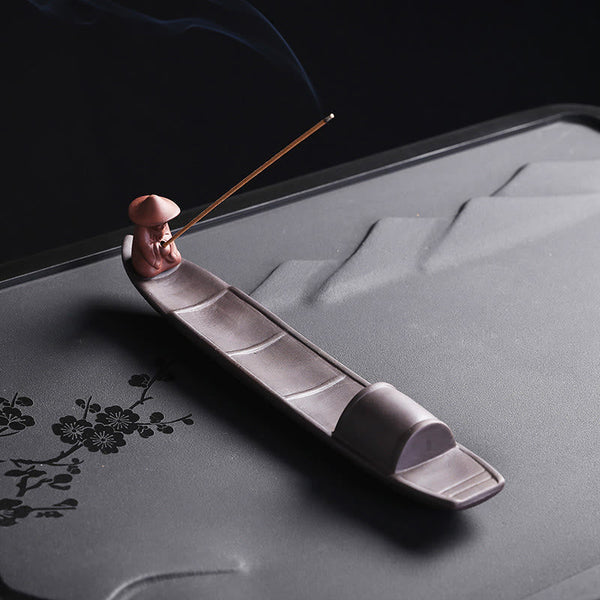 Fisherman Boat Purple Clay Incense Burner – reverse angle on carved tea tray with incense, meditative ambiance