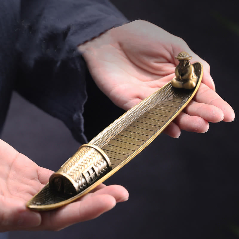 Fisherman Boat Alloy Incense Burner – held in hands showing size and bronze texture, artisan craft