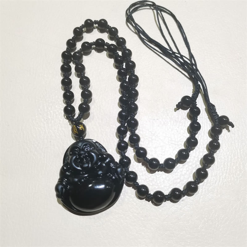 Black Obsidian Buddha Necklace – gift pouch with black satin and Buddha nestled, elegant packaging