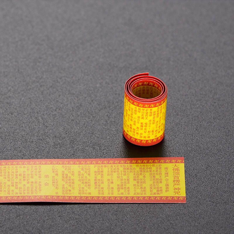 Prayer Wheel Lotus Necklace – unrolled golden Buddhist scripture scroll with red text, Devotional