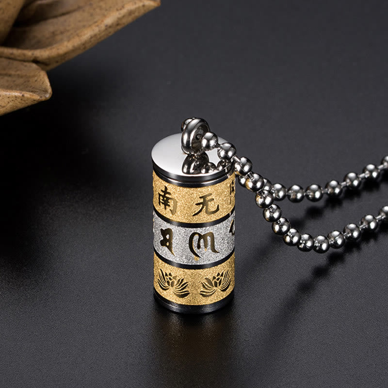 Prayer Wheel Lotus Necklace – two-tone pendant with dried botanicals on dark backdrop, Harmonious