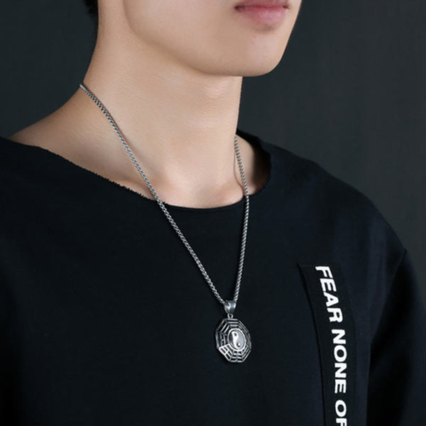 Titanium Steel Bagua Yin Yang Necklace - Silver Bagua pendant worn by male model, lifestyle jewelry shot