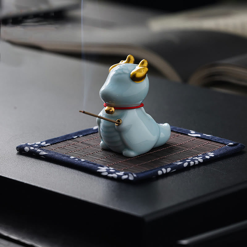 Ceramic Dragon Bell Incense Burner – white glaze with gold horns and red bell, rear elevated view, Purity