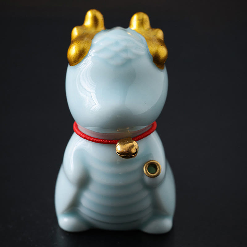 Ceramic Dragon Bell Incense Burner – front low angle on black background, gold horn accents, Strength